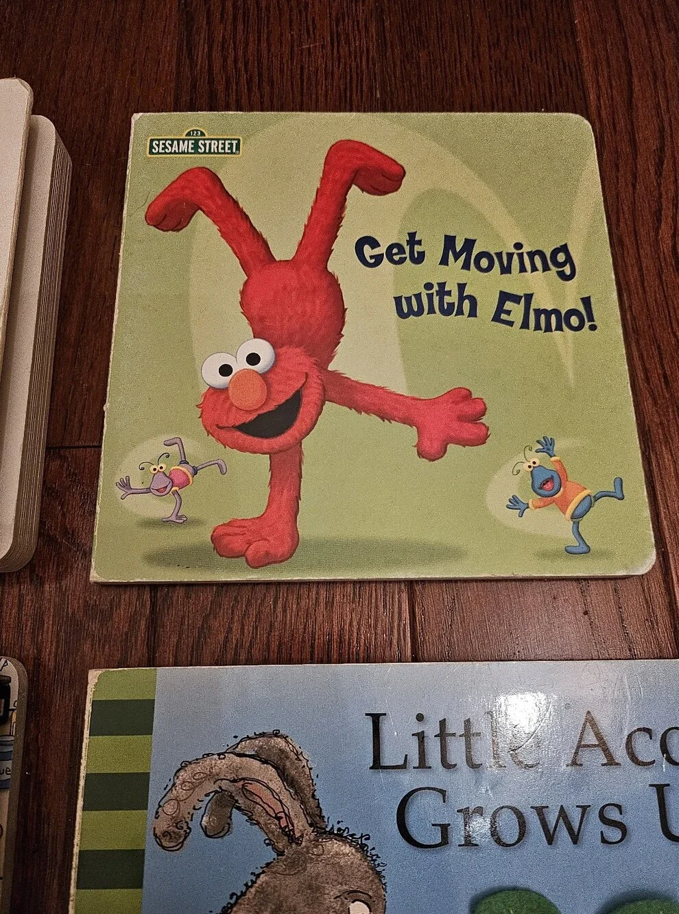 4 Board Books Curious George, Elmo, How To Be Good and Smart.